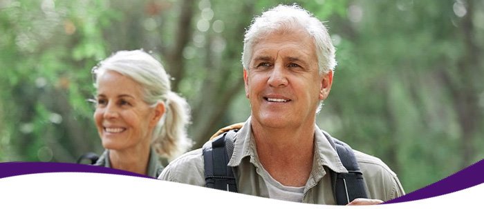Older couple hiking, representing mobility, strength, and good orthopedic care