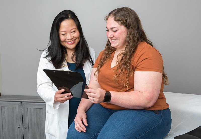 Doctor consulting patient on different birth control methods
