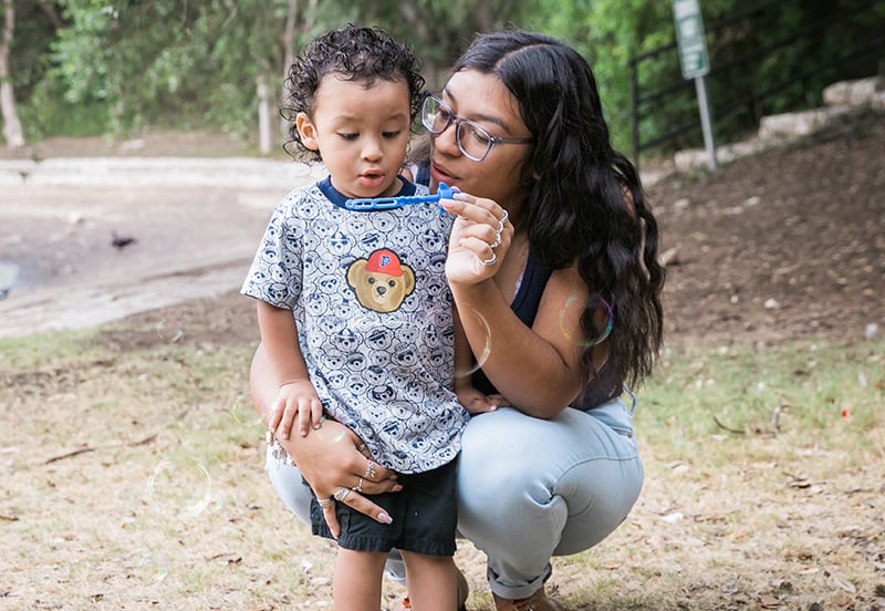 Mom talking to child with an ear infection