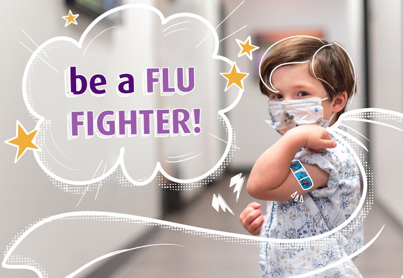 Boy flexing after receiving a flu vaccination in Austin