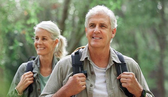 Older couple enjoying a hike, representing mobility, strength, and proper orthopedic care