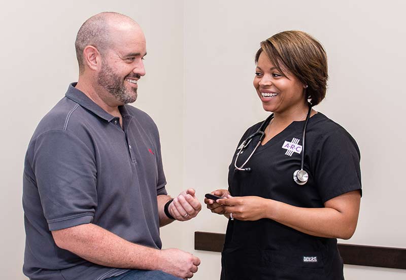 Austin Regional Clinic nurse sing a patient
