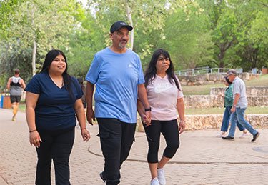 ARC patient and loved ones enjoying a walk at the park in Austin