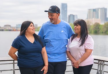 ARC patient and loved ones having a good time at a dock at Lady Bird Lake in Austin