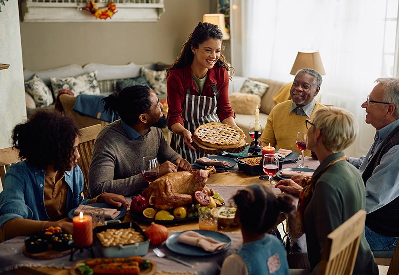 Family enjoying their Thanksgiving Day meal