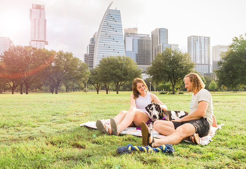 Austinite couple enjoying a beautiful day outside at Zilker Park during allergy season