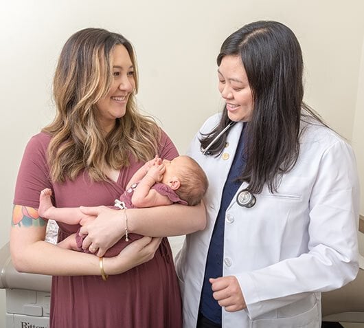 doctor with mom and baby