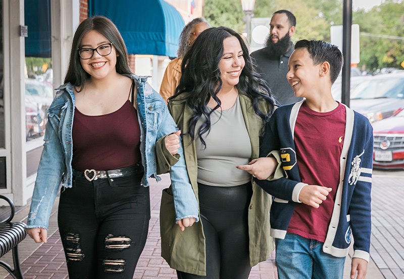 Mother, daughter, and son enjoying a nice day out during flu, allergies, cold, and COVID-19 season