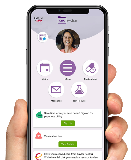 Hand holding phone with mychart app displayed