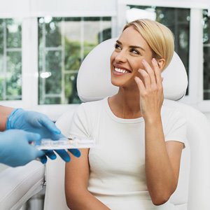 Woman smiling after dermatology treatment