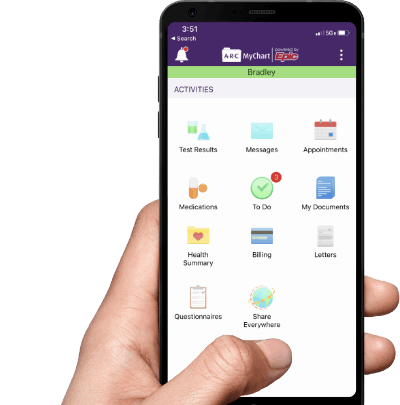 Hand holding phone with mychart app displayed