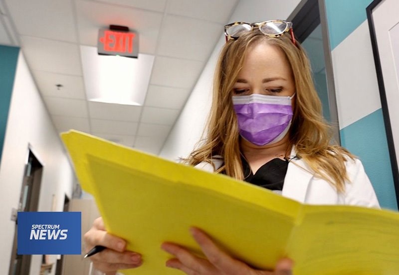 Obstetrician looking at documents in a clinic